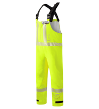 The Lac-Mac Multi-Haz Protective Overall (706ZABJ) for flammable liquid chemical hazards is waterproof, high-visibility yellow with reflective strips, black adjustable shoulder straps, and a front chest pocket, shown on a white background.