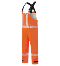 The Lac-Mac Multi-Haz Protective Overall 706ZABJ offers protection against flammable liquid chemical hazards, featuring high-visibility orange GORE-TEX PYRAD, reflective white stripes, and black adjustable suspenders for worksite safety.