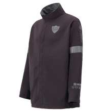 The Lac-Mac Switch Suit Jacket 707KA features a dark color, high collar, reflective patches on chest, arm, and sleeve, visible branding, and FR ARC-Flash Rated protection up to 75 Cal for NFPA 70E compliance.